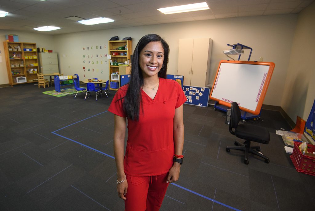 Reyes poses for a photo in the Department of Communications Sciences and Disorders. 