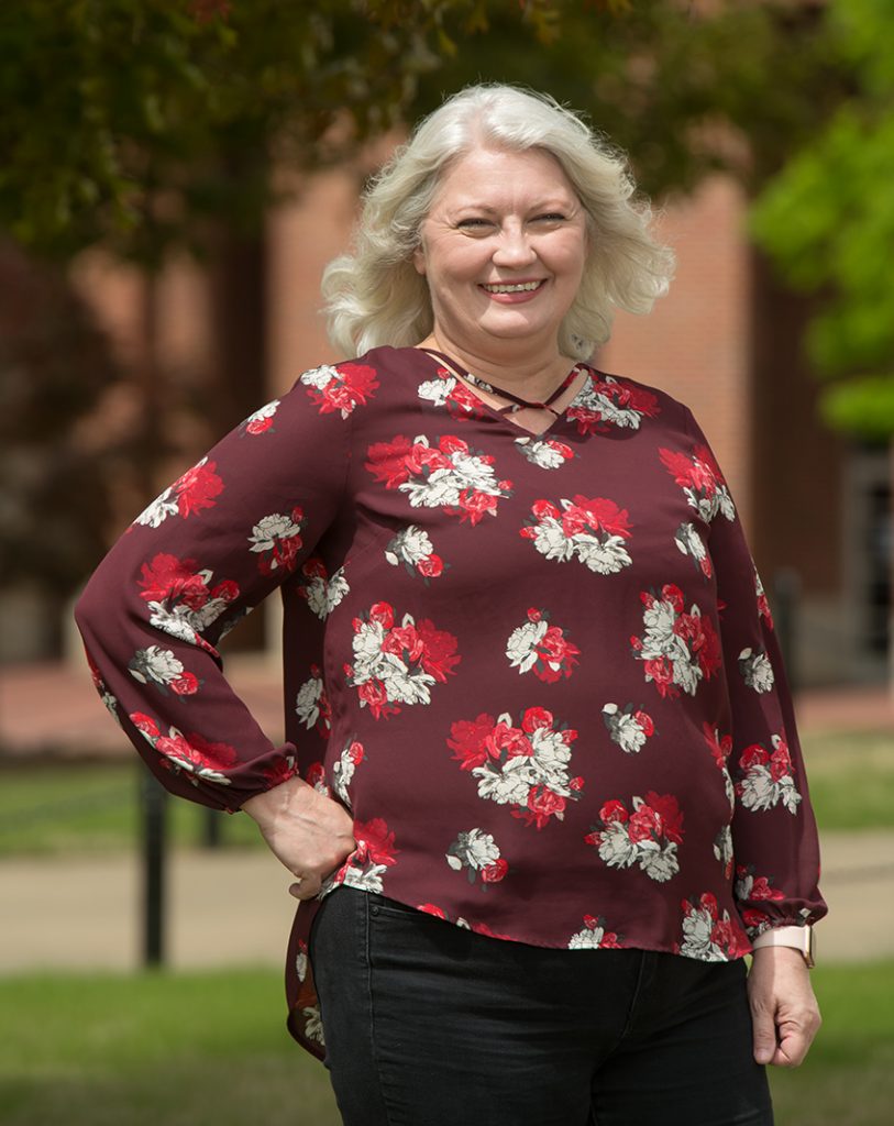 Cindy DeFelice poses for a photo on the Ole Miss campus.