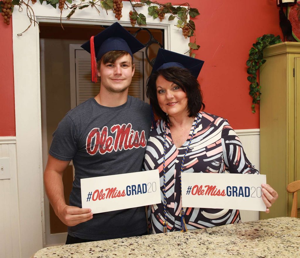 Michelle Adcox and her son Ben pose for a photo in their kitchen