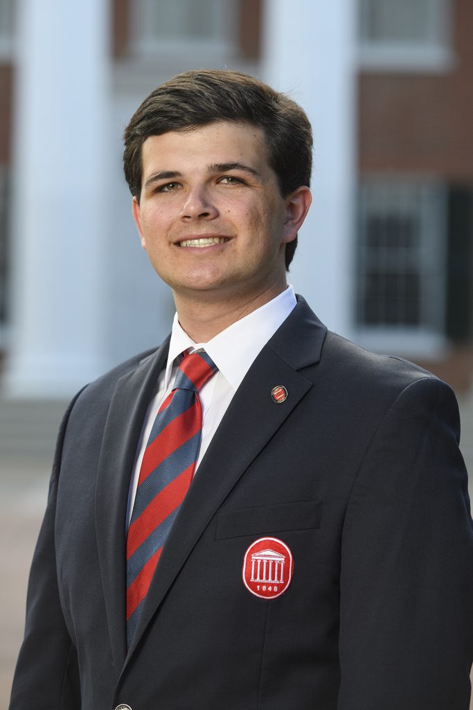 Chad Gutierrez poses for a picture as part of the Columns Society membership.