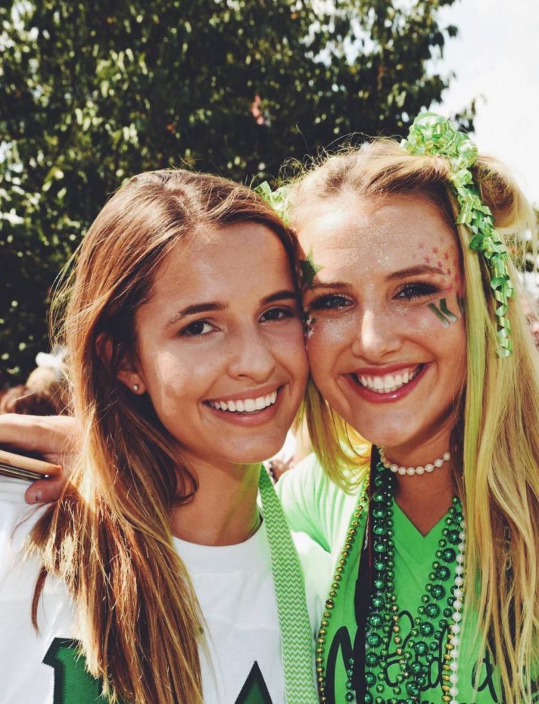 Macey Hicks with Avery Robinson dressed in green on Bid Day