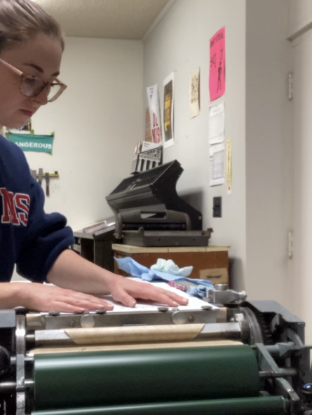 Taylor in the Letterpress studio in Meek Hall printing part of her thesis, Ipseity, on the Vandercook letterpress machine.