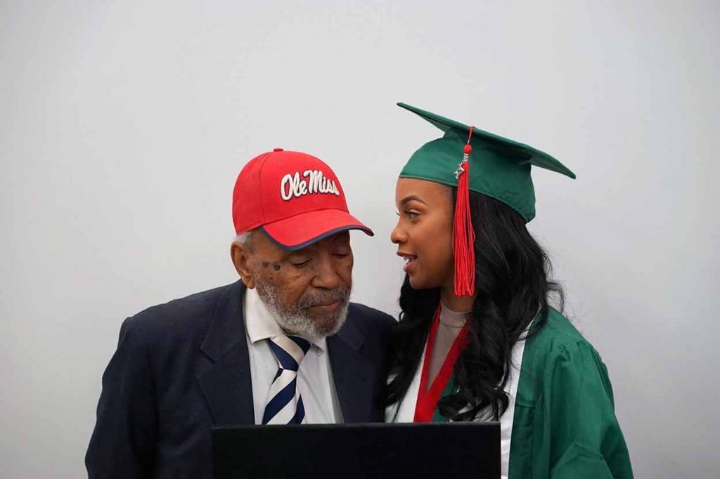 James Meredith (left) and Jasmine Meredith in cap and gown