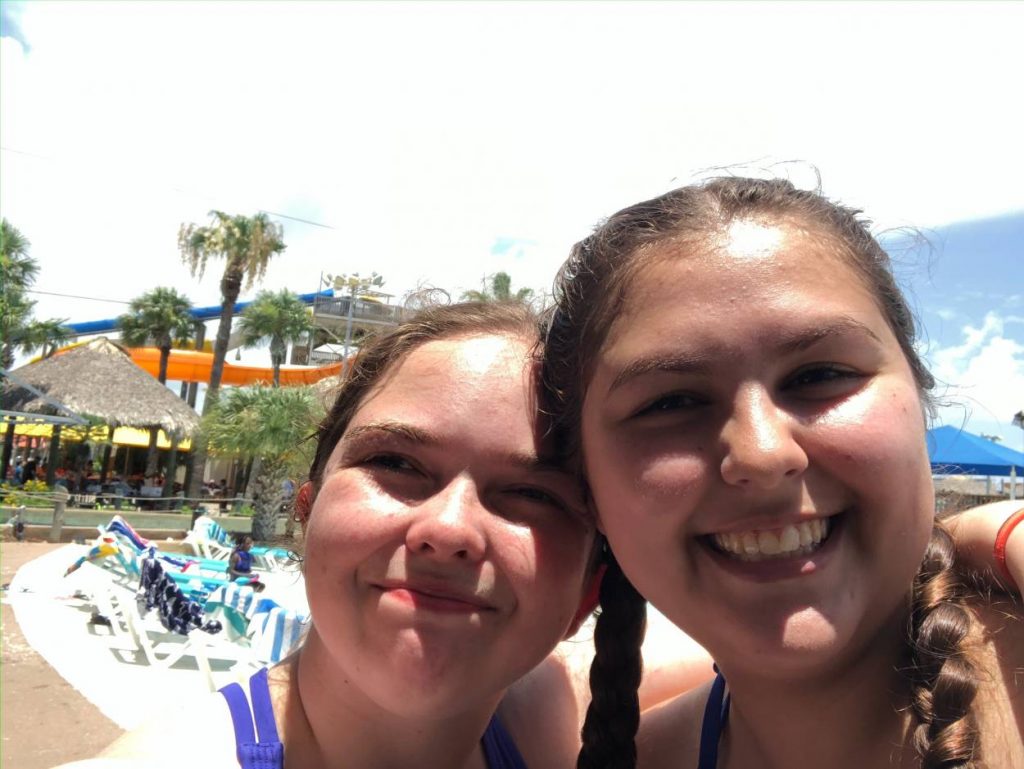 2022 computer science grad Tayler Glover spends time at the pool with friend Allison Crull.