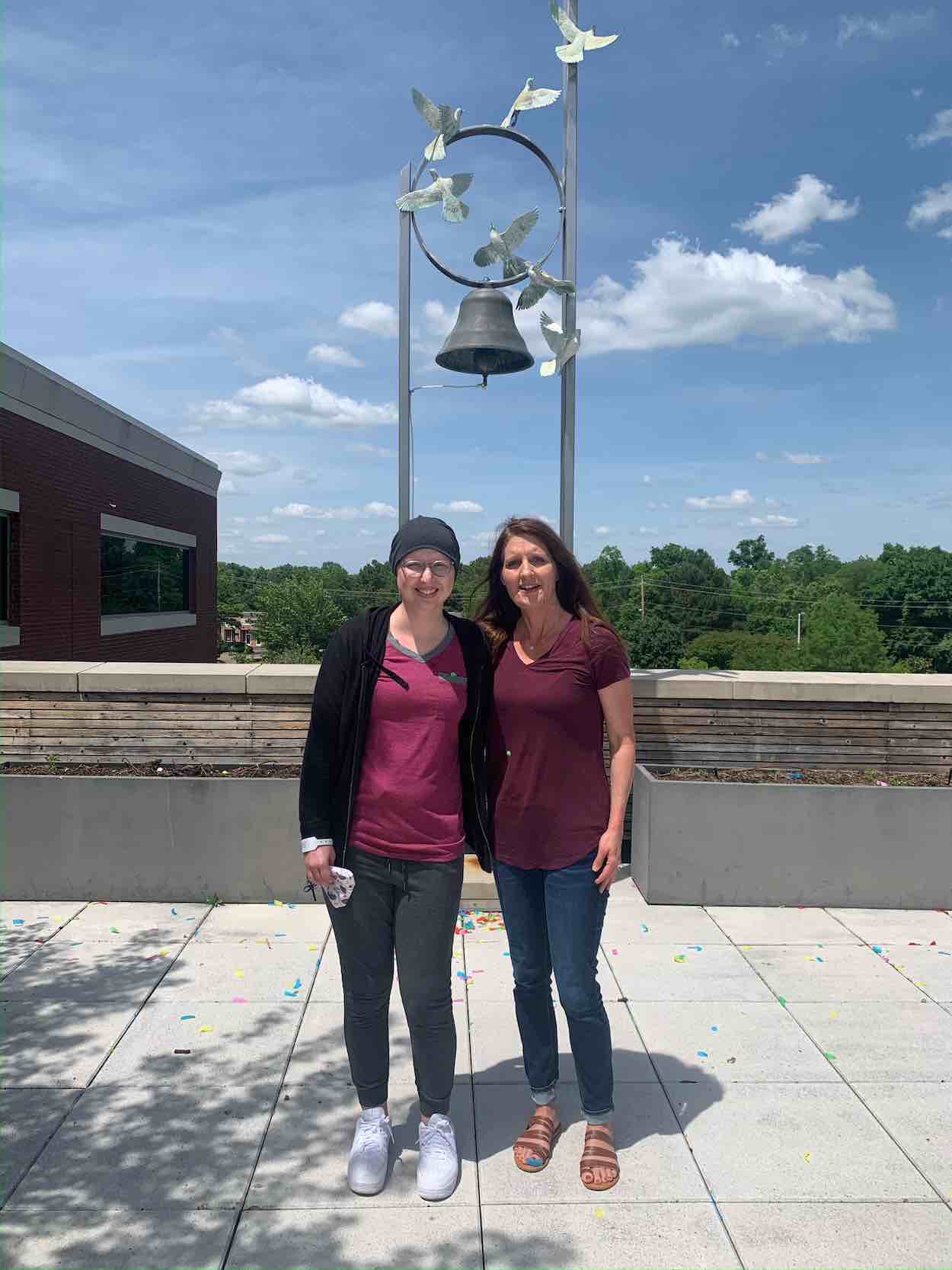 Heidi Myers poses with her mom after ringing the bell on her last day of chemotherapy. ‘All the nurses working in infusion had confetti and cheered, so it was a nice moment,’ Myers said. Submitted photo