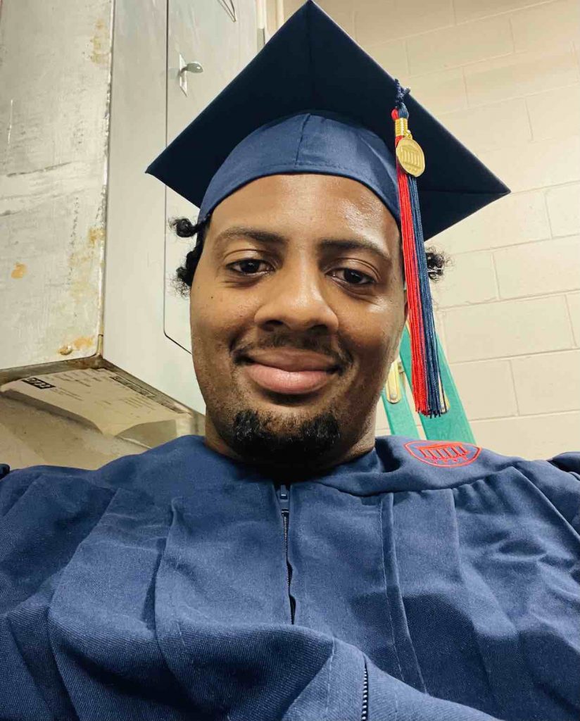 Hill in his blue graduation cap and gown.